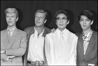 black and white image of David Bowie, Jack Thompson, Nagisa Oshima and Ryuichi Sakamoto