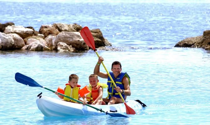 Max van Heeswijk paddles with his sons in 2004