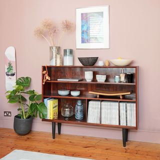 pink living room with sideboard