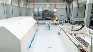 Technicians at Thales Alenia Space in Turin, Italy prepare the HALO habitat module for transport to the United States.