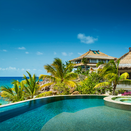 villa with pool and coconut trees