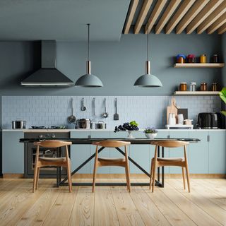 Blue painted kitchen with wooden accents