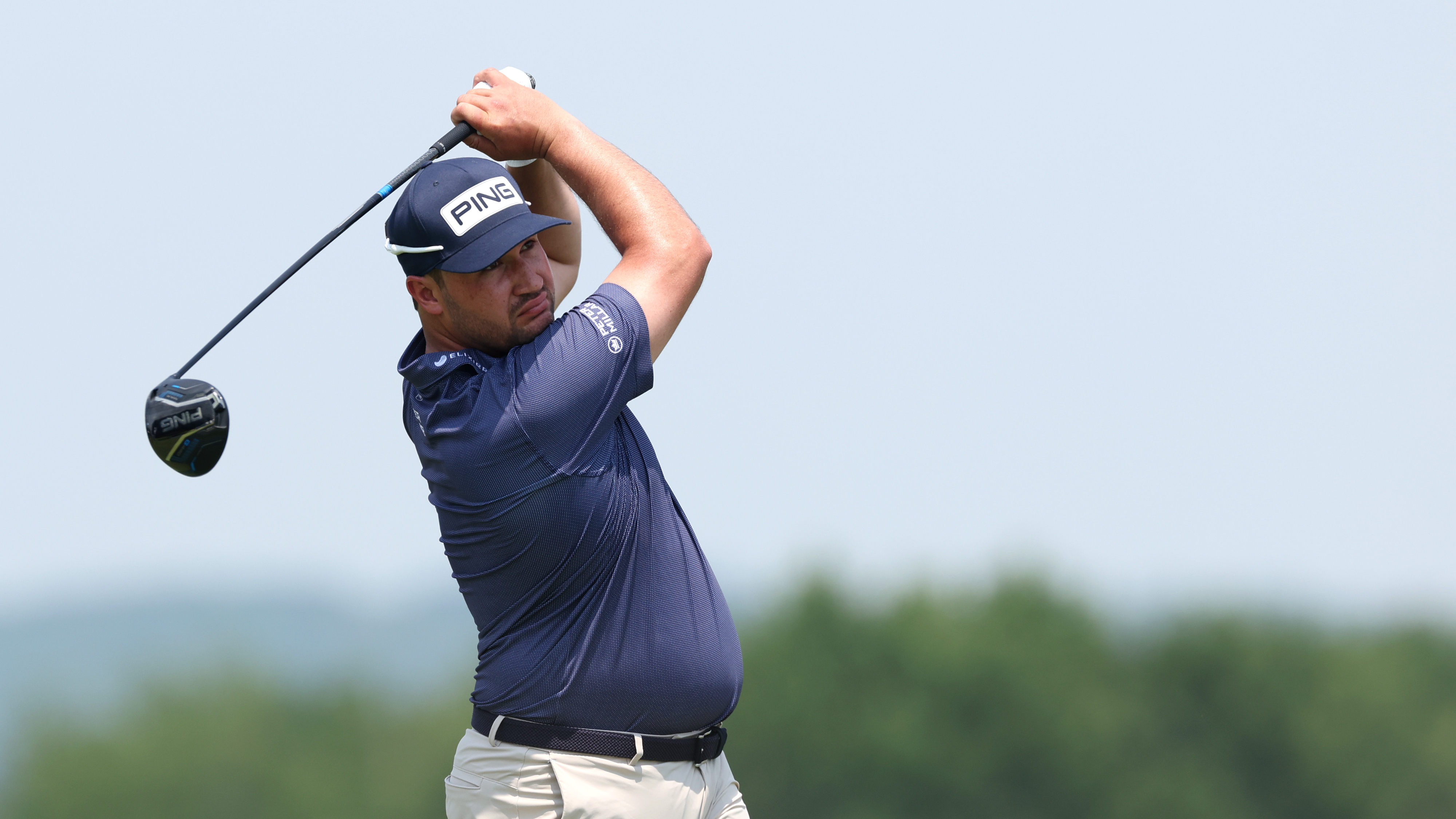 Thriston Lawrence holding a pose after hitting a drive at the 2025 US Open