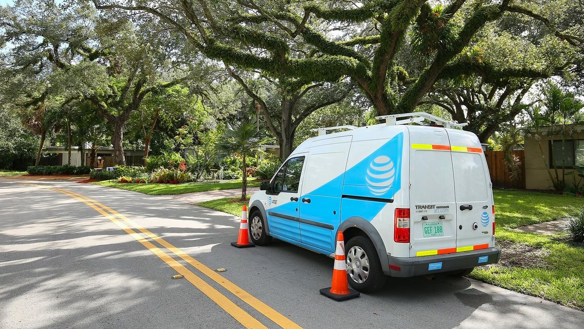 AT&amp;T vehicle parked on a residential street as workers go in back yards to add fiber optics to utility poles in neighborhoods as seen on December 1st, 2017.