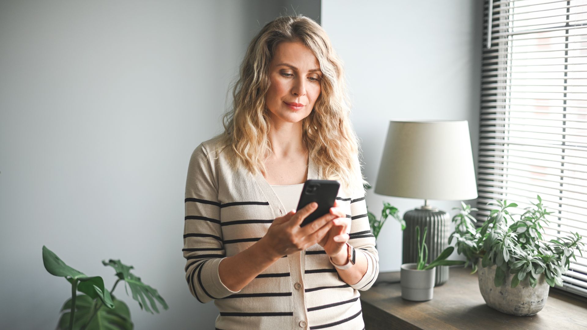 woman standing and talking on the phone
