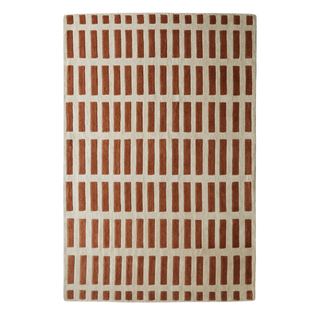 rug with geometric pattern in burnt orange and light tan