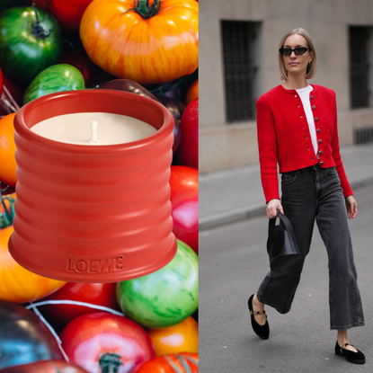 A woman wearing a red cardigan, a white t shirt and jeans. She is next to a tomato-scented candle, which is in front of a tomato background.