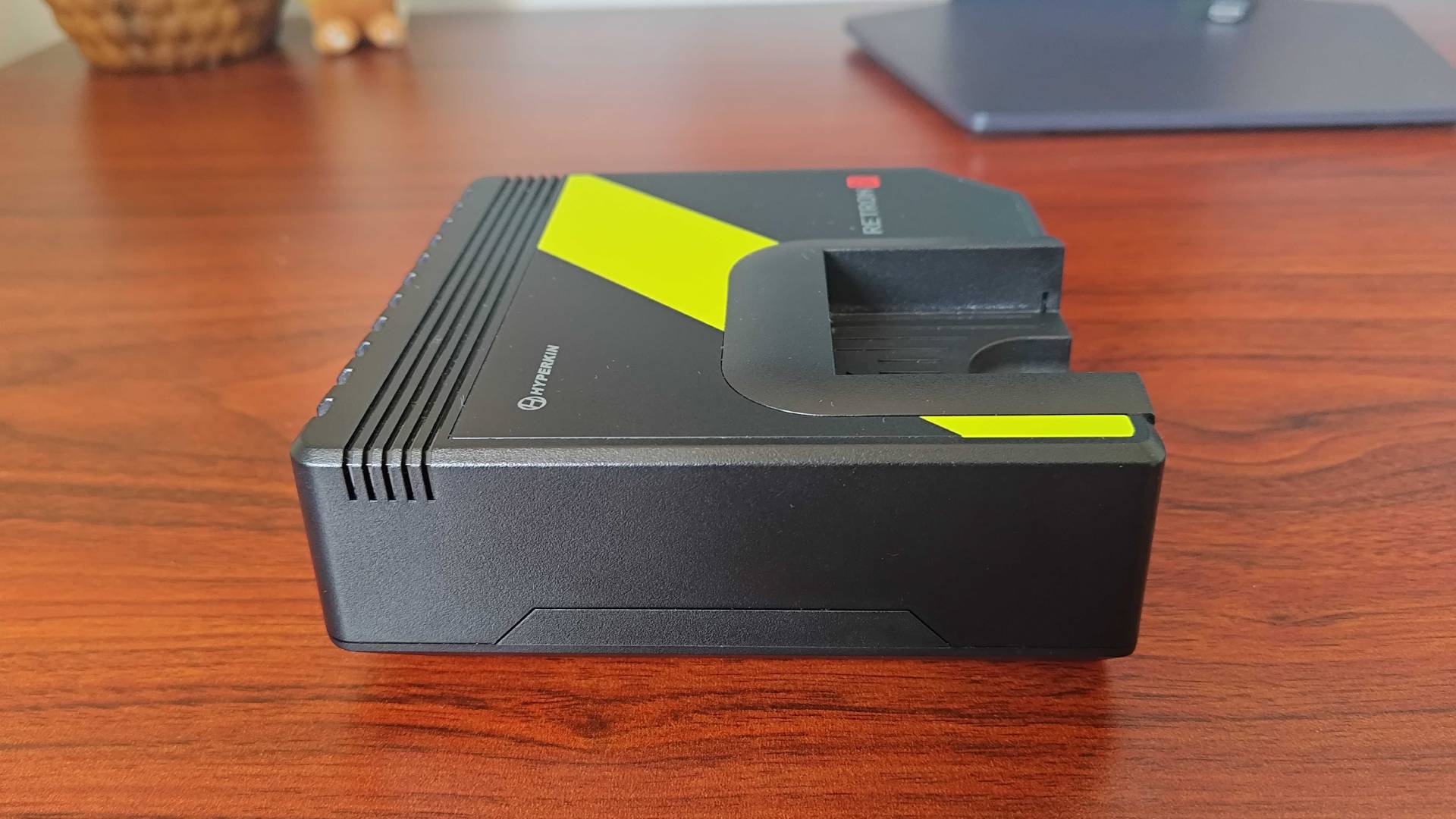 Hyperkin Retron GX side view on woodgrain desk.