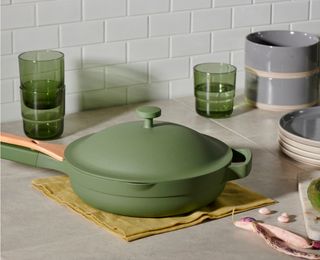 Our Place Always Pan in green alongside our place kitchenware