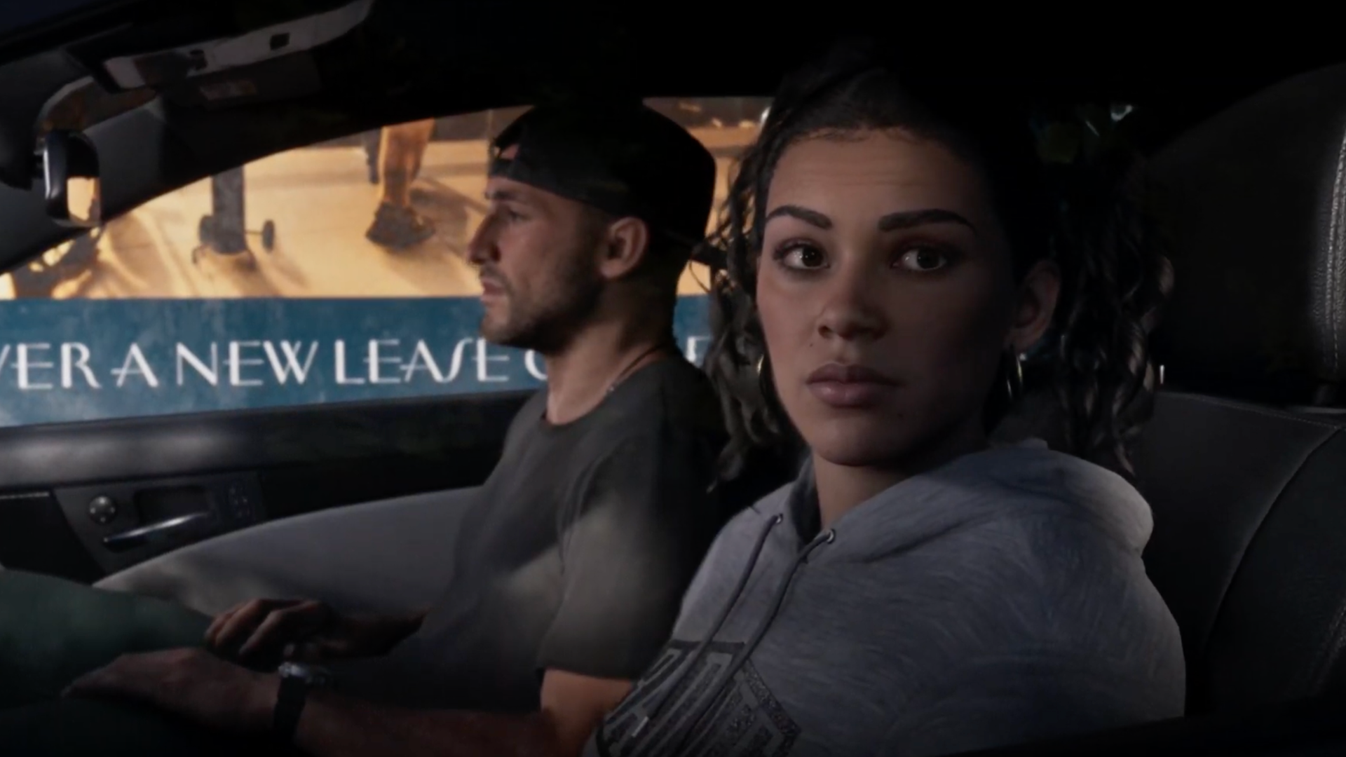 Jason and Lucia sit in a car