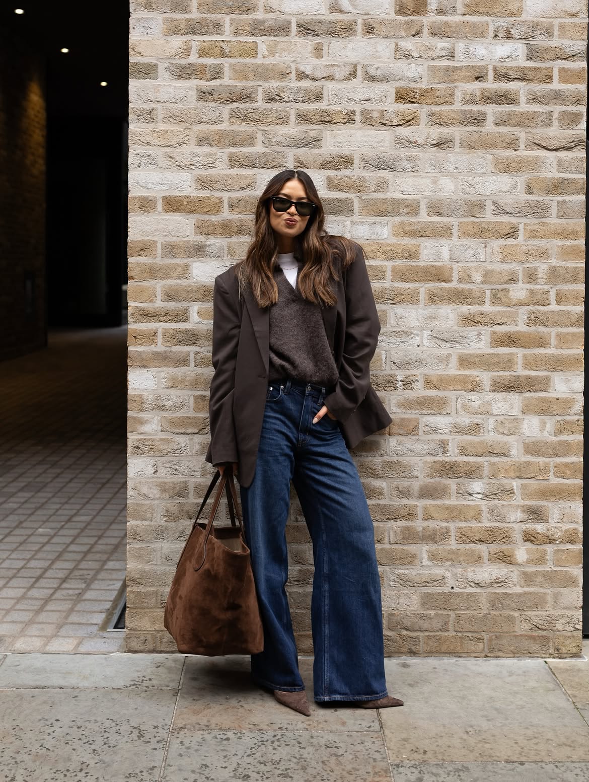 Vanessa wearing brown jumper