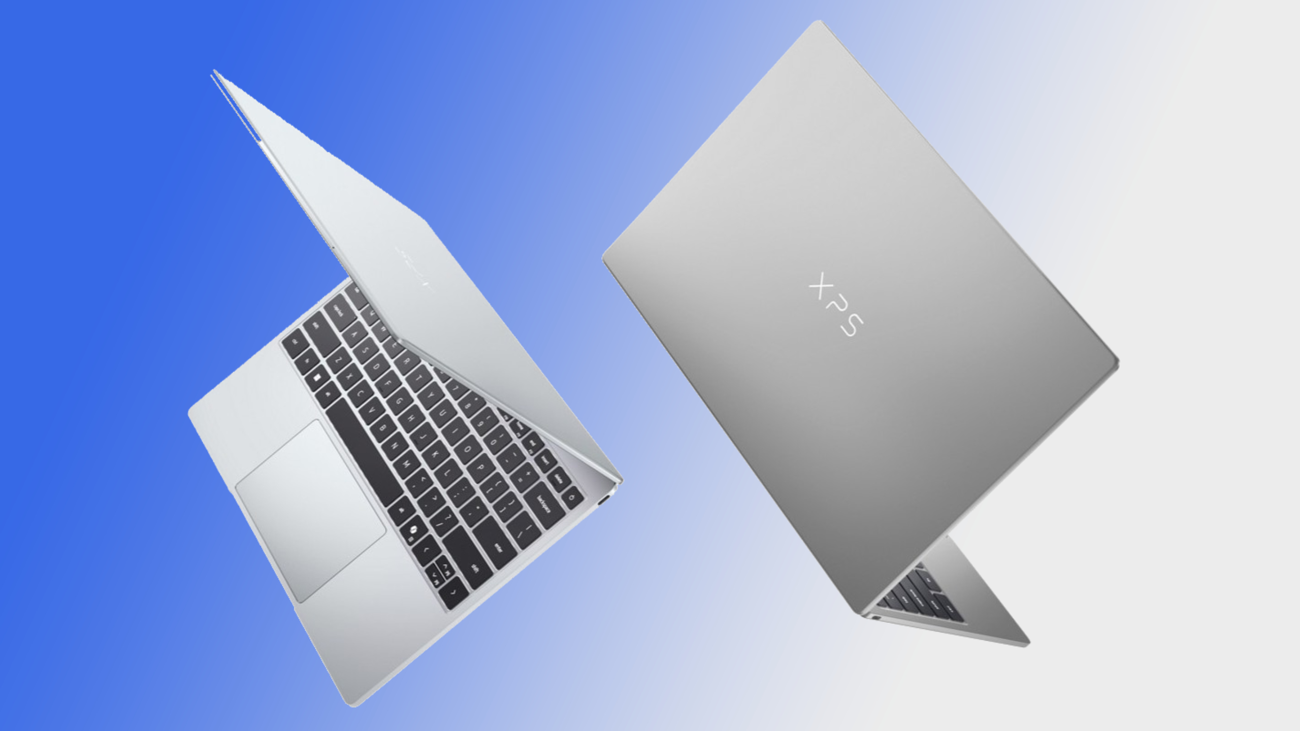 Two Dell XPS 13 2026 laptops on a blue and grey background.