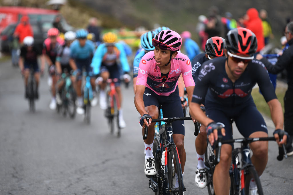 VALLE SPLUGA ALPE MOTTA ITALY MAY 29 Egan Arley Bernal Gomez of Colombia and Team INEOS Grenadiers Pink Leader Jersey passing through Splgenpass Passo dello Spluga 2115m mountain landscape during the 104th Giro dItalia 2021 Stage 20 a 164km stage from Verbania to Valle Spluga Alpe Motta 1727m Snow UCIworldtour girodiitalia Giro on May 29 2021 in Valle Spluga Alpe Motta Italy Photo by Tim de WaeleGetty Images