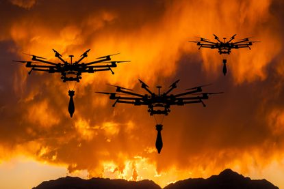 Military drone in the sky at sunset. 