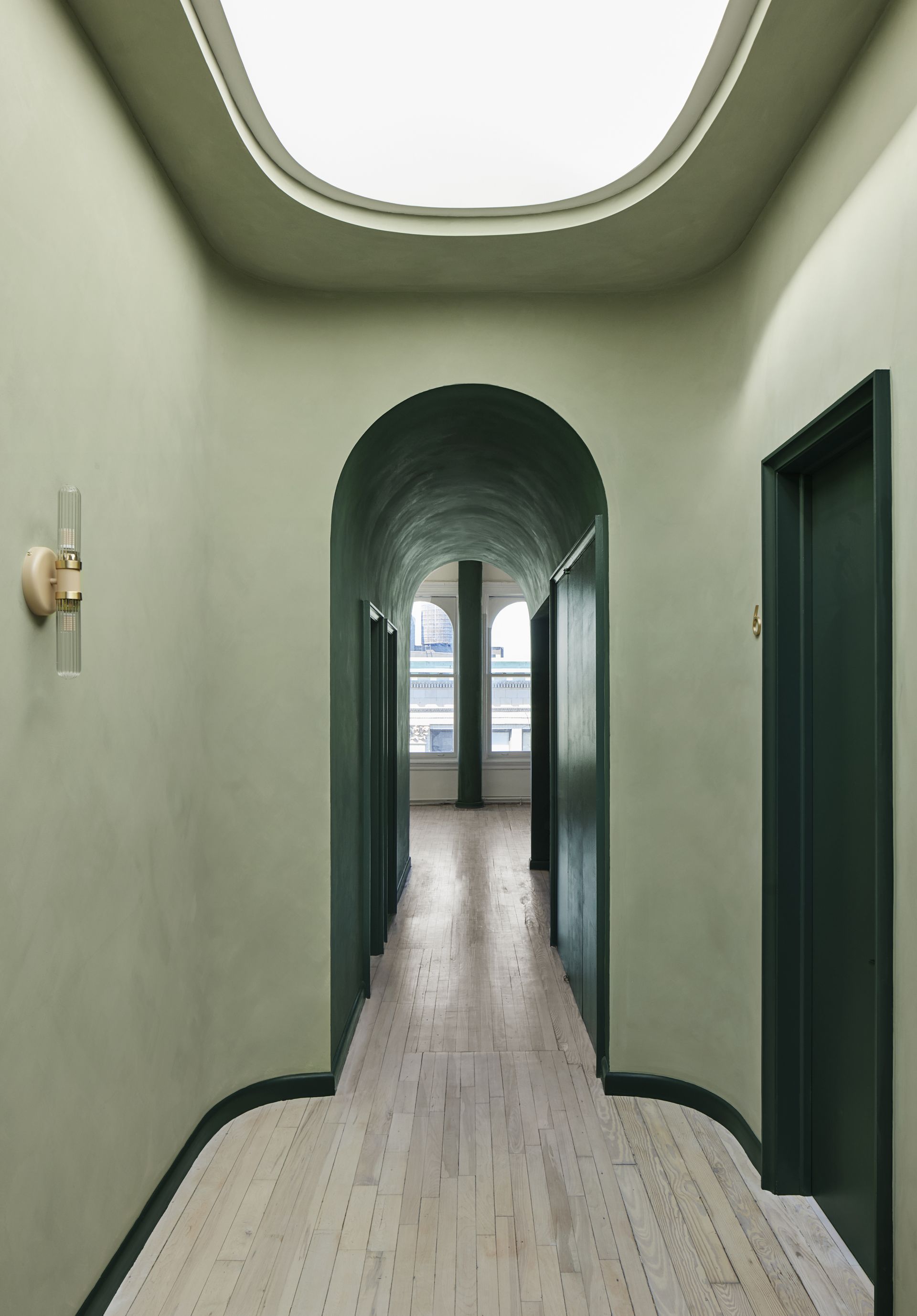 A passageway painted in light and dark green