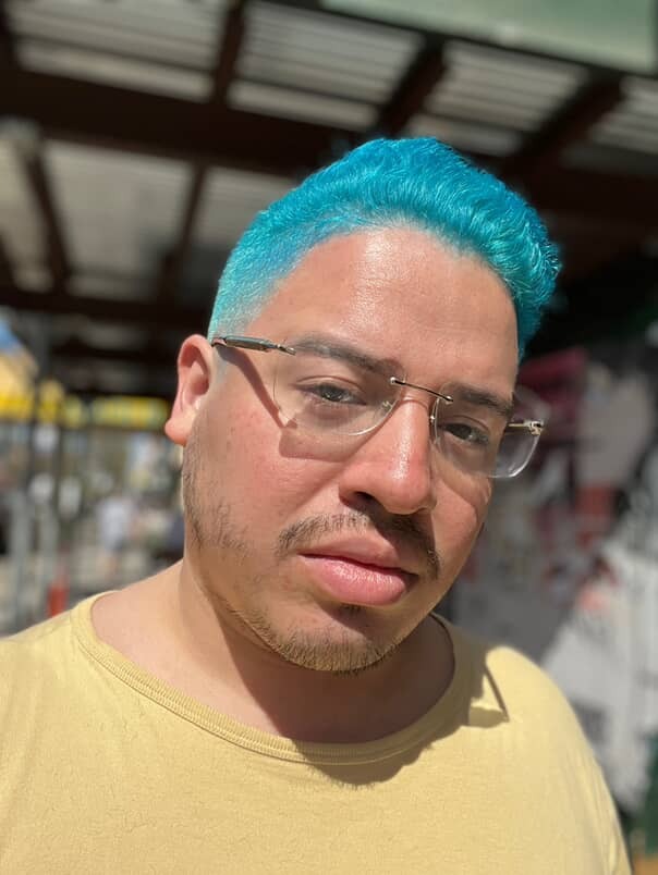 Selfie of Richard Gallo with bright blue hair.