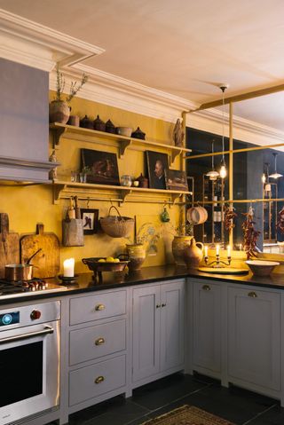 grey works in the kitchen to make the yellow walls really shine