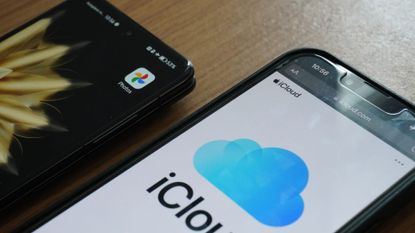 Two phones displaying iCloud and Google Photos apps