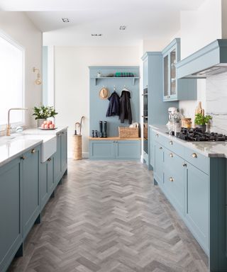 Galley kitchen with blue cabinetry