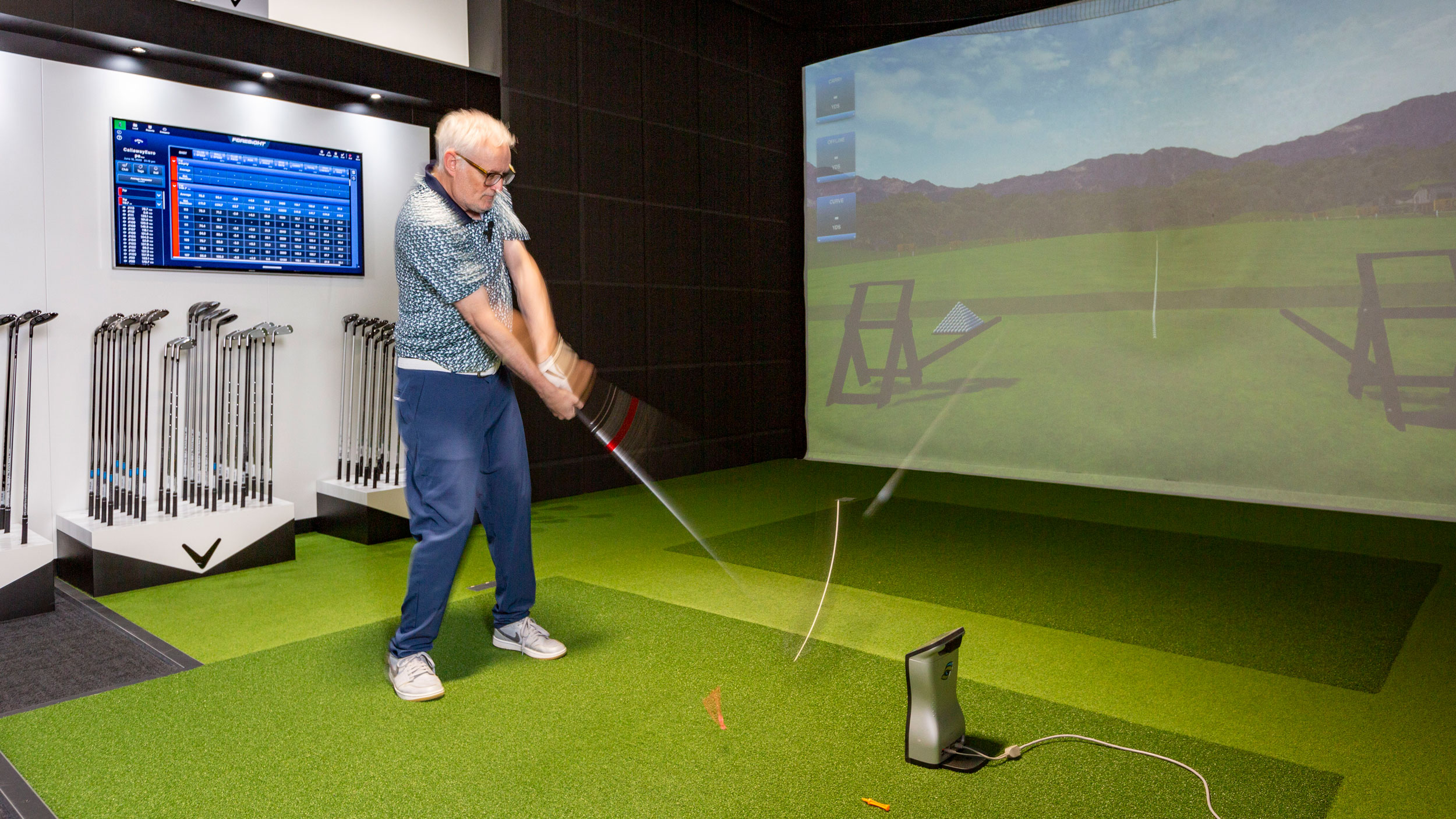 Golfer hits Callaway driver during fitting