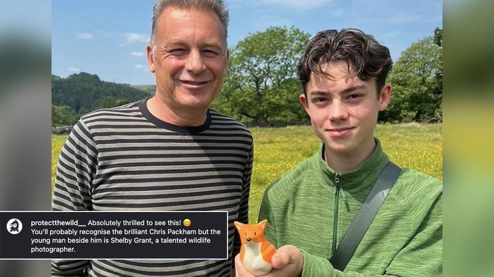 Chris Packham and Shelby Grant holding a ceramic fox sculpture, while standing in a field
