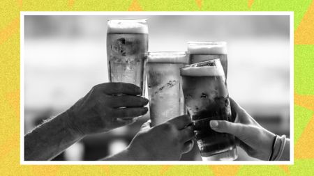 A group of friends clinking beer glasses together