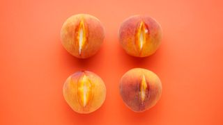 four peaches on peach background