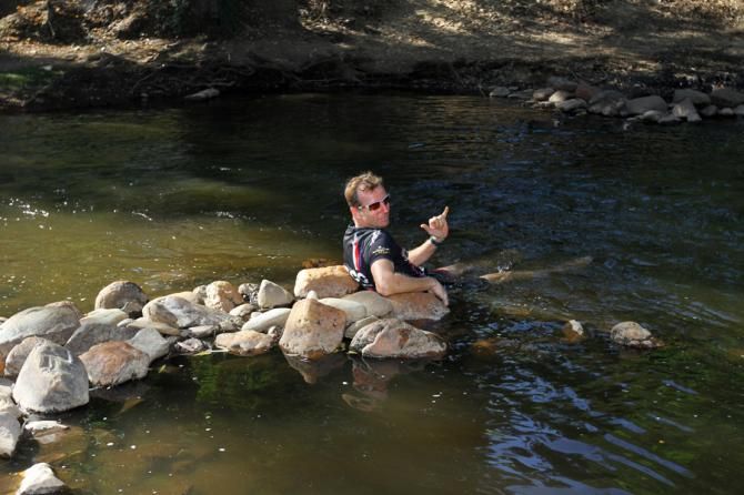 Roger Derrick cools off in a river after the eliminator