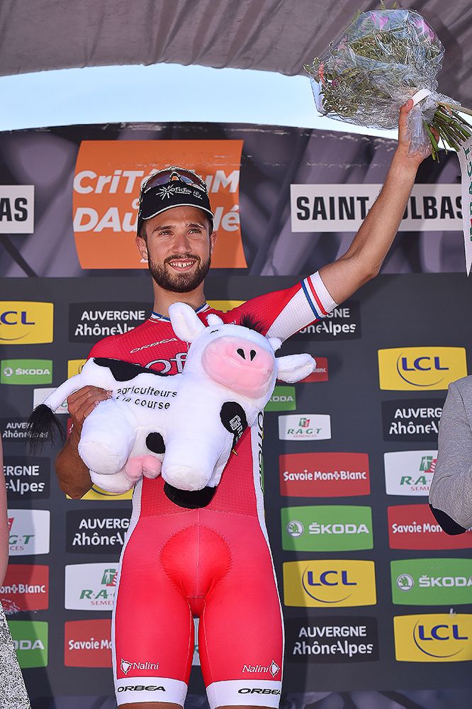 Nacer Bouhanni celebrates on the podium after winning Dauphine's first stage