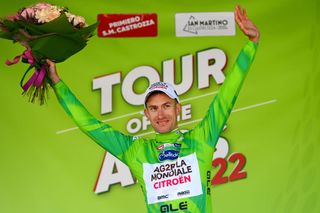 SAN MARTINO DI CASTROZZA ITALY APRIL 18 Geoffrey Bouchard of France and AG2R Citroen Team celebrates winning the green leader jersey on the podium ceremony after the 45th Tour of the Alps 2022 Stage 1 a 1609km stage from Cles to PrimieroS Martino di Castrozza 708m TouroftheAlps on April 18 2022 in San Martino di Castrozza Italy Photo by Tim de WaeleGetty Images