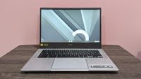 Best Chromebook deals Acer Chromebook 514 on a wooden desk against a pink background