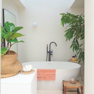 off-white bathroom with tall plants around