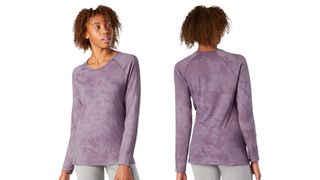 Woman wearing the Smartwool Merino 150 base layer, lilac, on a white background