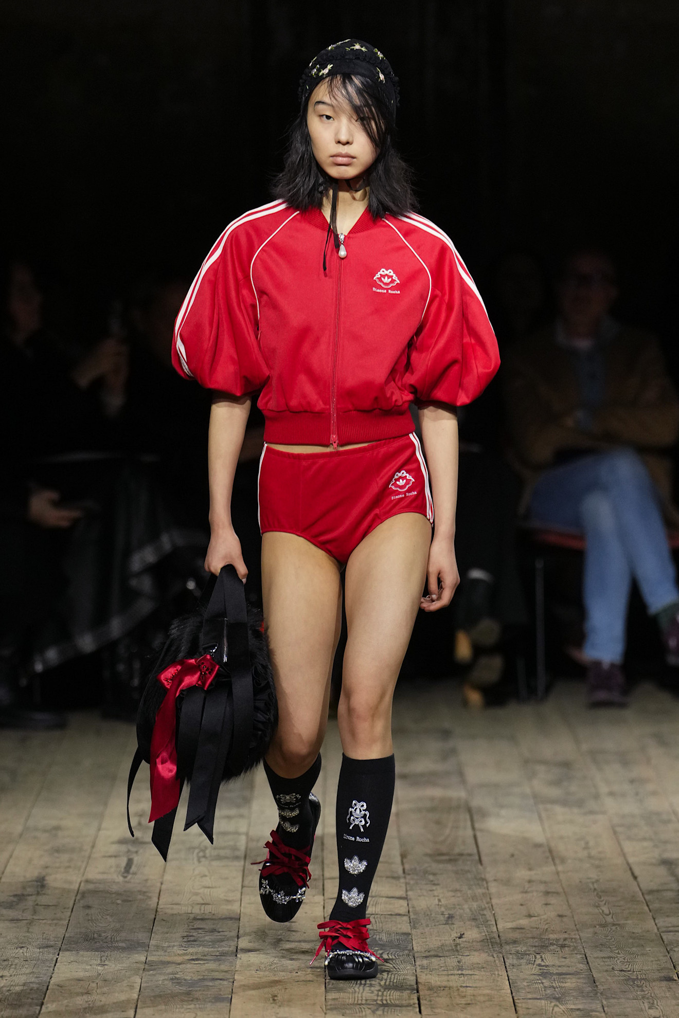 a model wears an adidas x simone rocha matching set and sneakers on the simone rocha runway