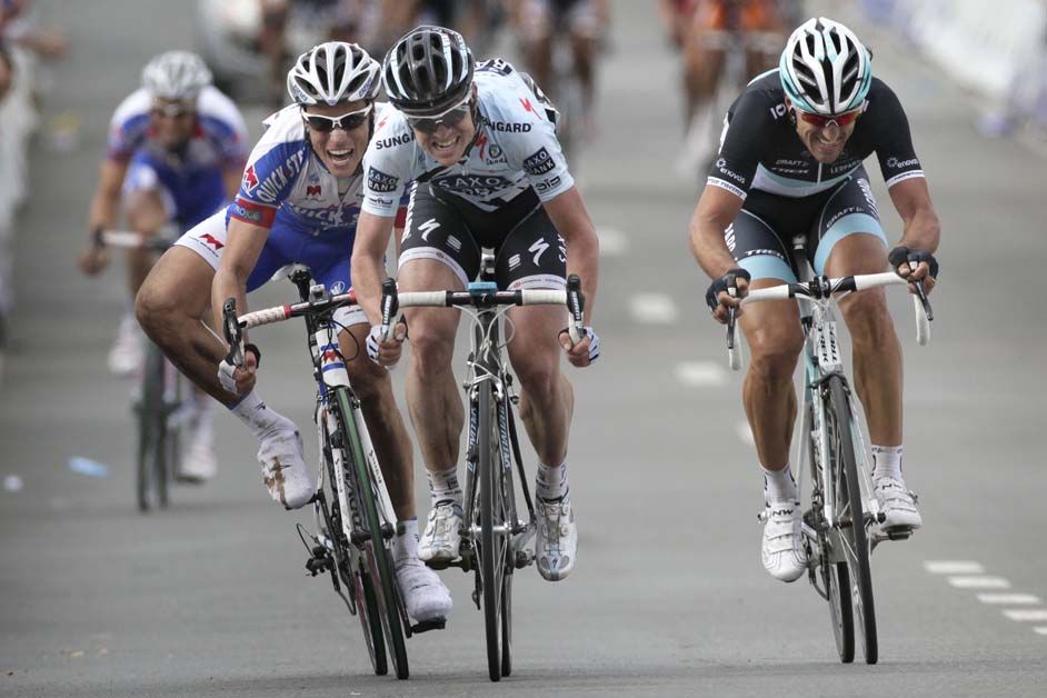 Sylvain Chavanel sprinting against Nick Nuyens and Fabian Cancellara in the 2011 Tour of Flanders