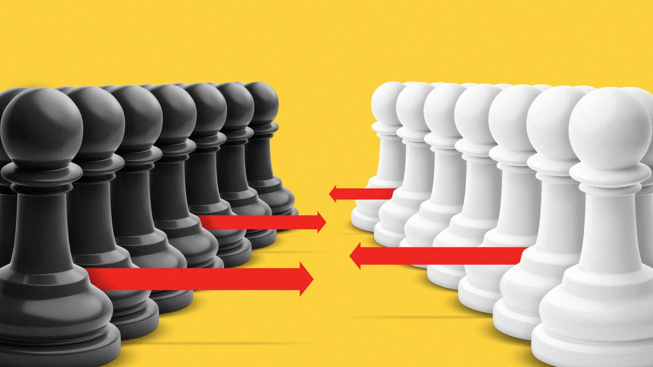 Two sets of chess pawns facing each other