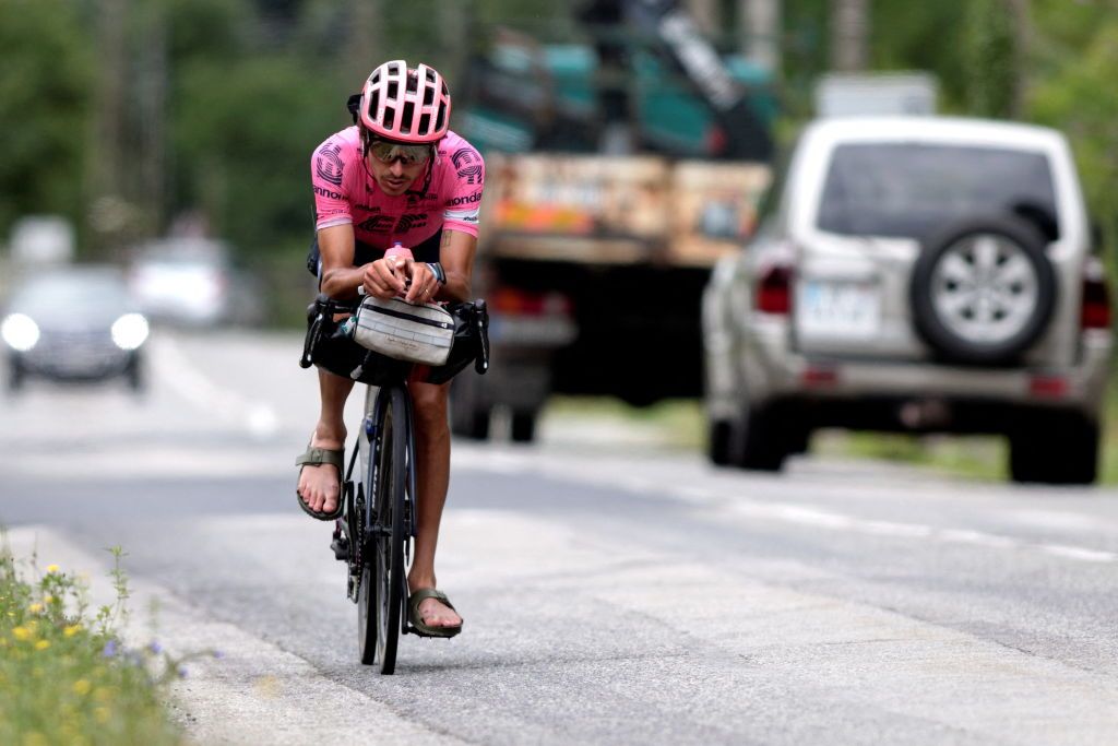 Australian cyclist Lachlan Morton rides on the 13th day of his solo alternative Tour de France cycling race near TarasconsurAriege on July 8 2021 Lachlan Morton is riding every kilometer of the Tour de France plus the distances between race starts and finishes solo He stops at cafes for his food and sleep under the stars at night Morton is racing to raise money for World Bicycle Relief Photo by VALENTINE CHAPUIS AFP Photo by VALENTINE CHAPUISAFP via Getty Images