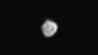 NASA's New Horizons space probe obtained the first well-resolved image of Nix, Pluto's moon, released during a press briefing held on July 17, 2015, at NASA Headquarters in Washington, DC.