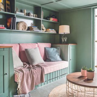 Living room with built-in day bed in painted sage