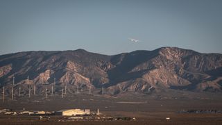 Stratolaunch's huge satellite-launching plane Roc soars over California's Mojave Desert during its first-ever test flight on April 13, 2019.