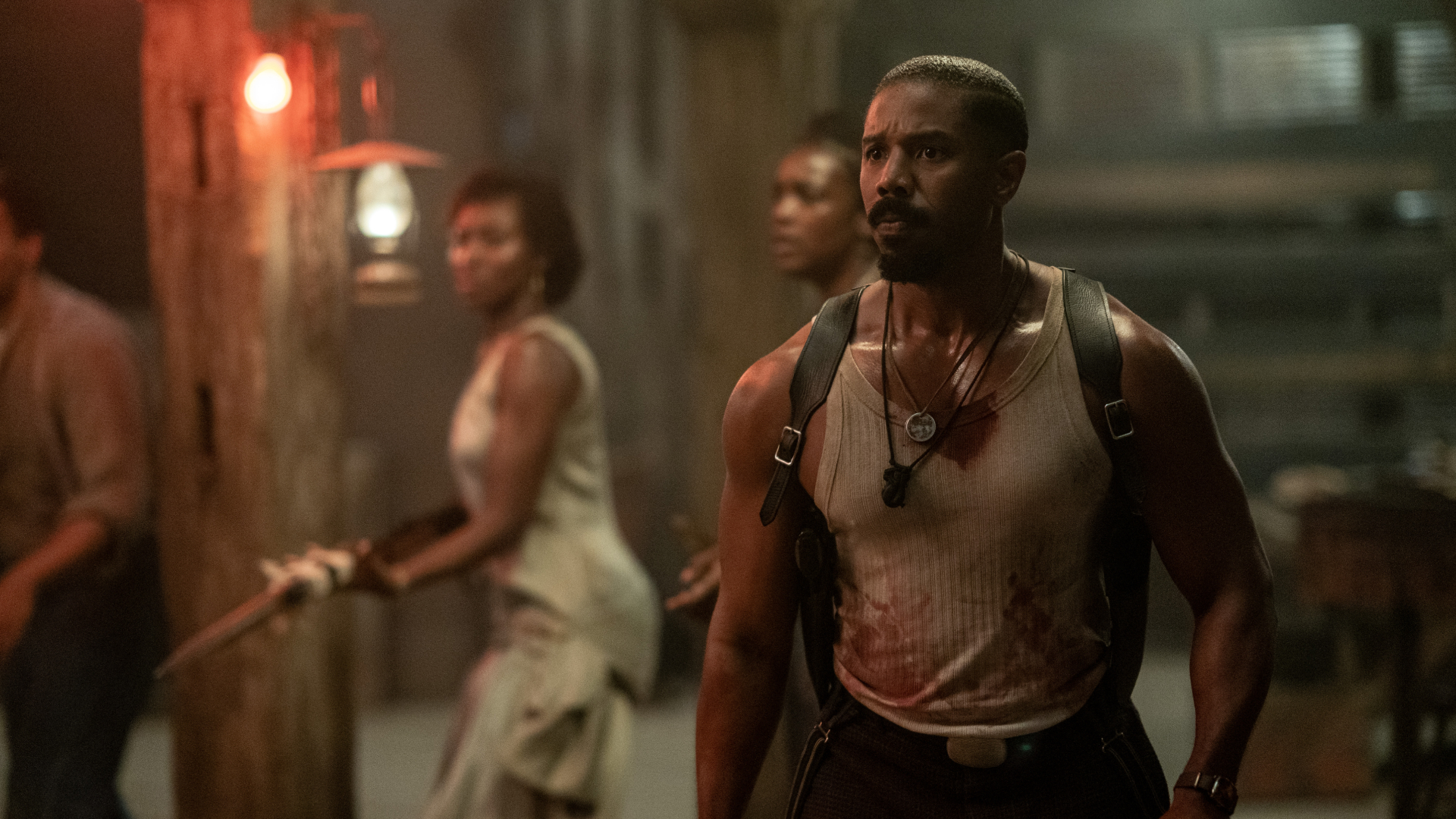 michael b jordan covered in blood in a still from sinners
