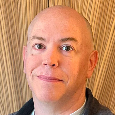 headshot of energy expert Simon Bones MD of Genous