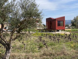 vanato cabin, a red timber cabin on wheels by kasawoo