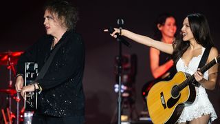 GLASTONBURY, ENGLAND - JUNE 29: (EDITORIAL USE ONLY) Olivia Rodrigo performs with Robert Smith of The Cure on the Pyramid stage during day five of Glastonbury festival 2025 at Worthy Farm, Pilton on June 29, 2025 in Glastonbury, England. Established by Michael Eavis in 1970, Glastonbury has grown into the UK's largest music festival, drawing over 200,000 fans to enjoy performances across more than 100 stages. In 2026, the festival will take a fallow year, a planned pause to allow the Worthy Farm site time to rest and recover. (Photo by Samir Hussein/WireImage)