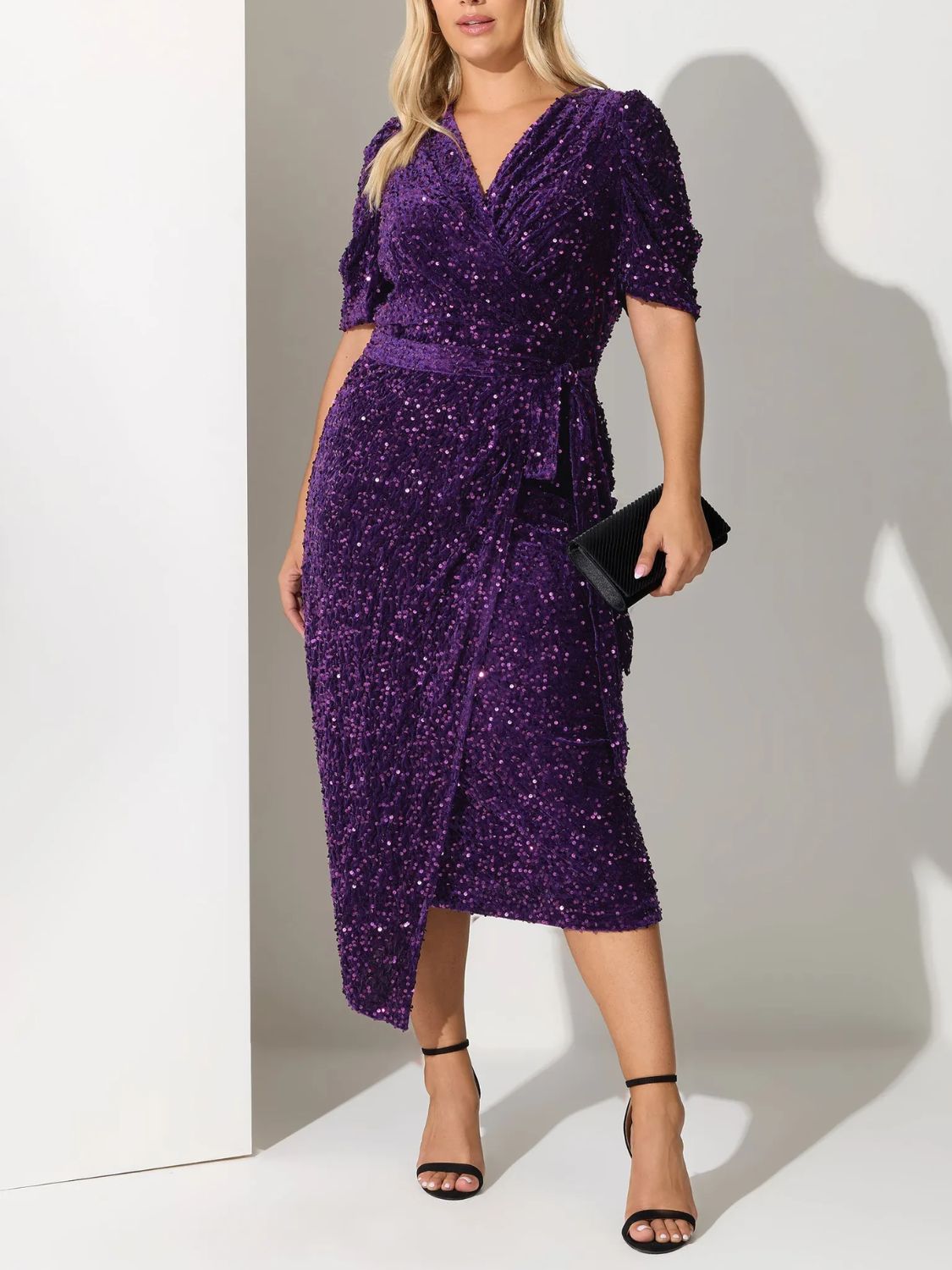 Curve Purple Sequin Velvet Wrap Dress on model 