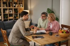 Financial advisor discussing life insurance with senior couple