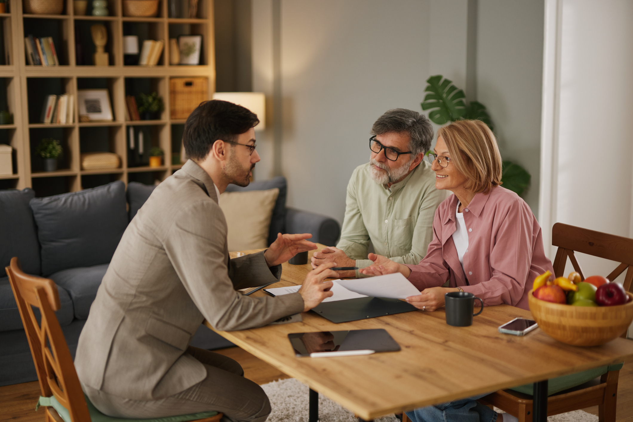 Financial advisor discussing life insurance with senior couple
