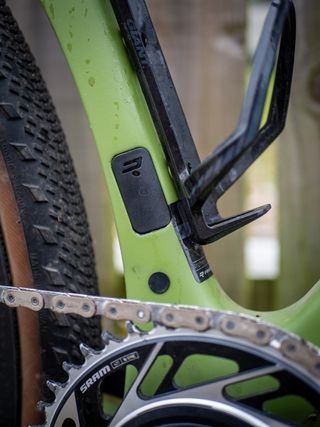 Detail photo of a green Ridley ASTR RS leaning against a wooden fence