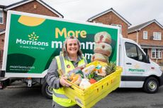 Woman holding a Morrisons Christmas food delivery