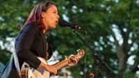 American folk and country singer and multi-instrumentalist Rhiannon Giddens performs on banjo with her band at Central Park